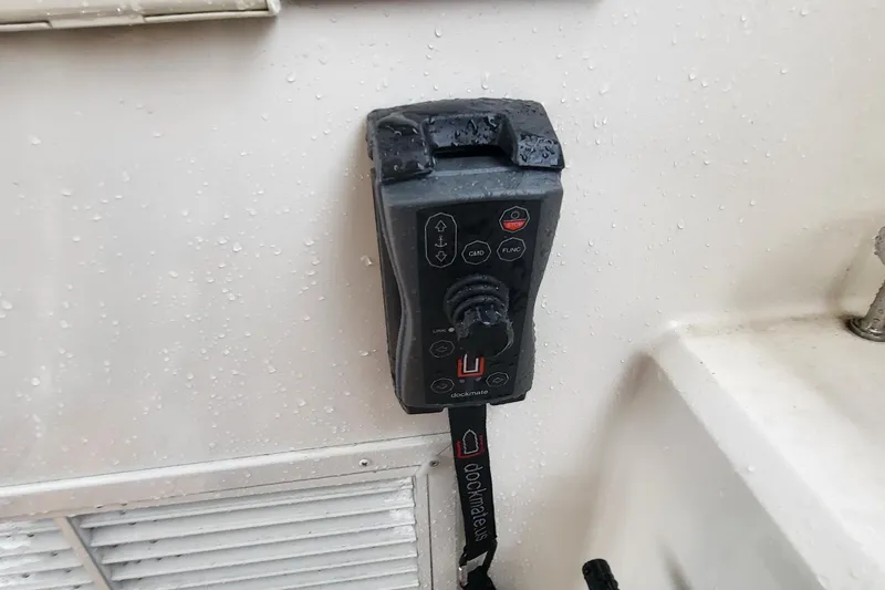 Slide: The Image of Control panel on a 2018 Sea Ray L590 Fly yacht, featuring Dockmate joystick. - 34