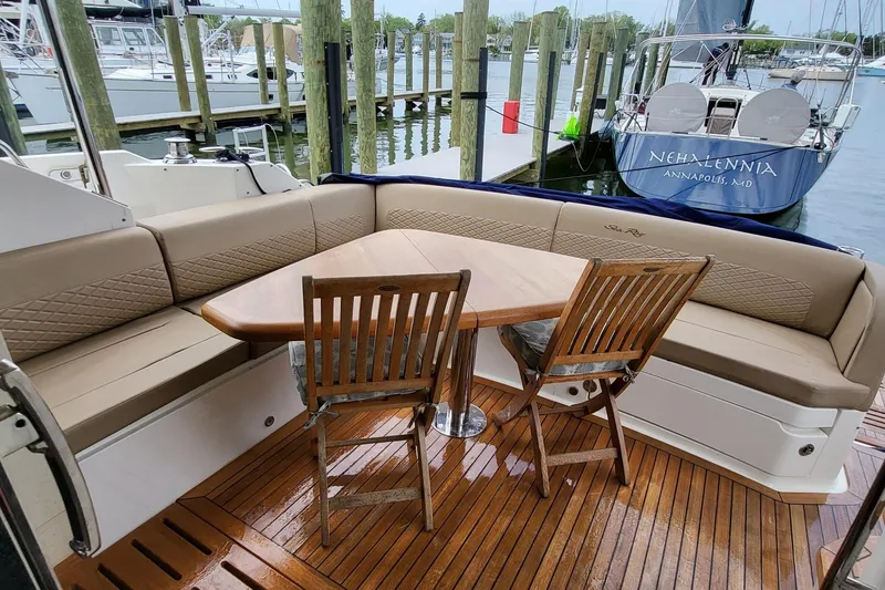 Slide: The Image of Luxurious 2018 Sea Ray L590 Fly yacht with elegant seating and wooden deck. - 40