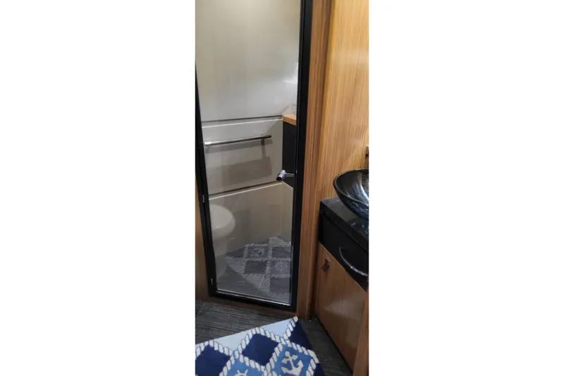 Slide: The Image of Bathroom interior of 2018 Sea Ray L590 Fly yacht with modern fixtures. - 47