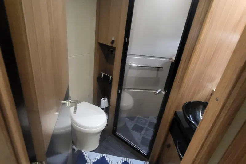 Slide: The Image of Luxurious bathroom interior of 2018 Sea Ray L590 Fly yacht with modern fixtures. - 49