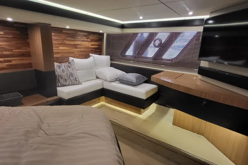 Slide: The Image of Luxurious interior of 2018 Sea Ray L590 Fly yacht with modern seating and wood accents. - 57