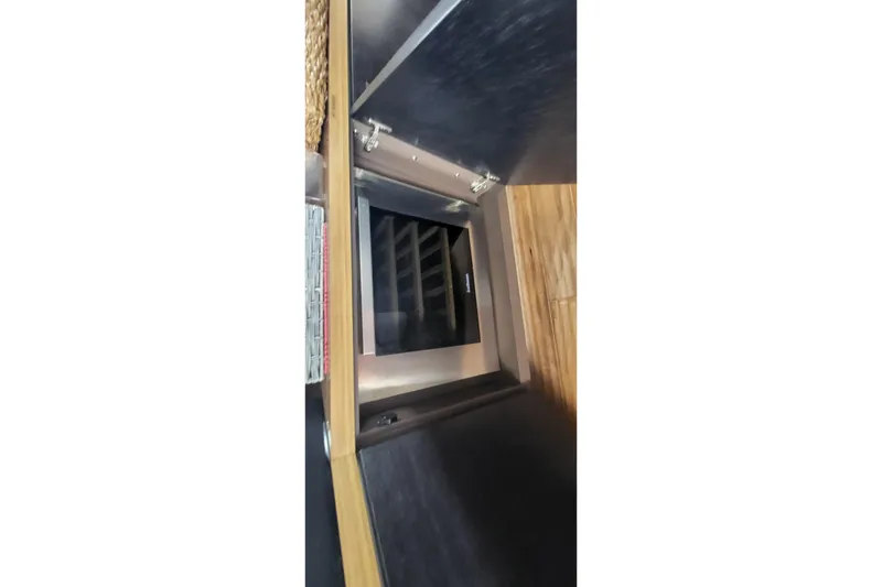 Slide: The Image of Interior view of 2018 Sea Ray L590 Fly yacht, featuring a built-in wine cooler. - 59