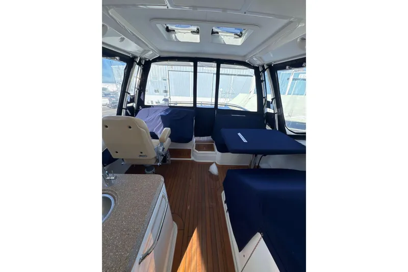 Slide: The Image of Interior of 2018 Sea Ray L590 Fly yacht with seating and kitchenette. - 6