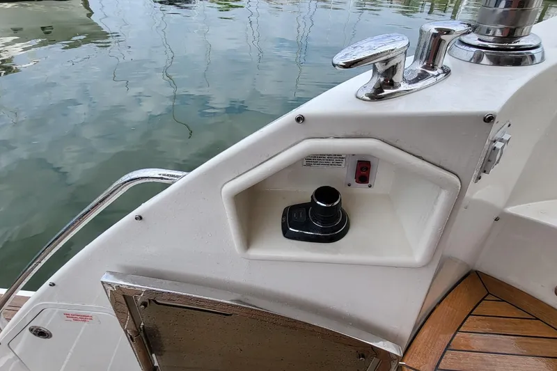 Slide: The Image of 2018 Sea Ray L590 Fly yacht deck with control panel and cleat. - 63