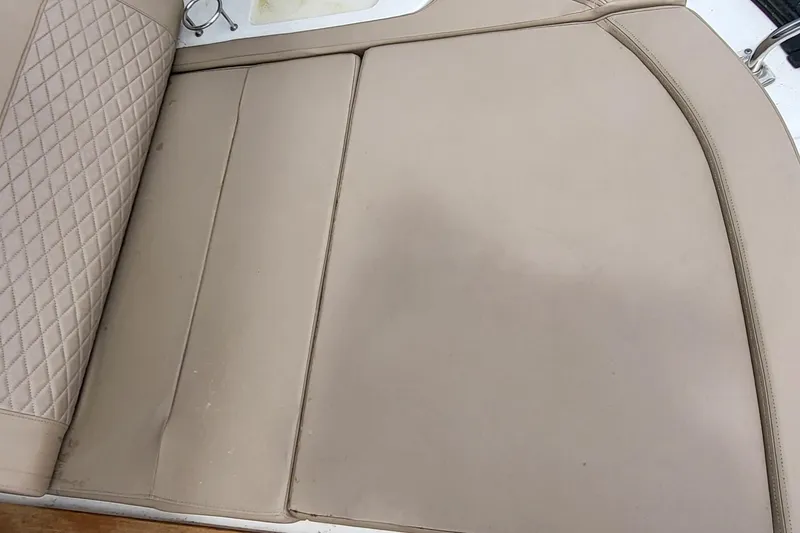 Slide: The Image of Beige leather seating on 2018 Sea Ray L590 Fly yacht, featuring diamond stitching. - 66