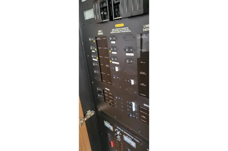 Slide: The Image of Electrical control panel on a 2018 Sea Ray L590 Fly yacht. - 68