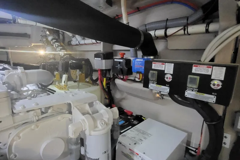 Slide: The Image of Engine room of 2018 Sea Ray L590 Fly yacht, showcasing mechanical and electrical components. - 70