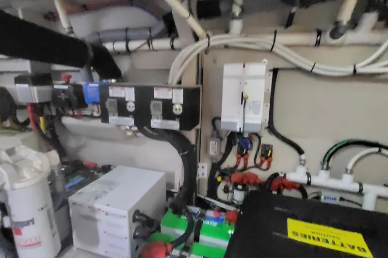 Slide: The Image of Engine room of 2018 Sea Ray L590 Fly yacht with electrical components and wiring. - 71