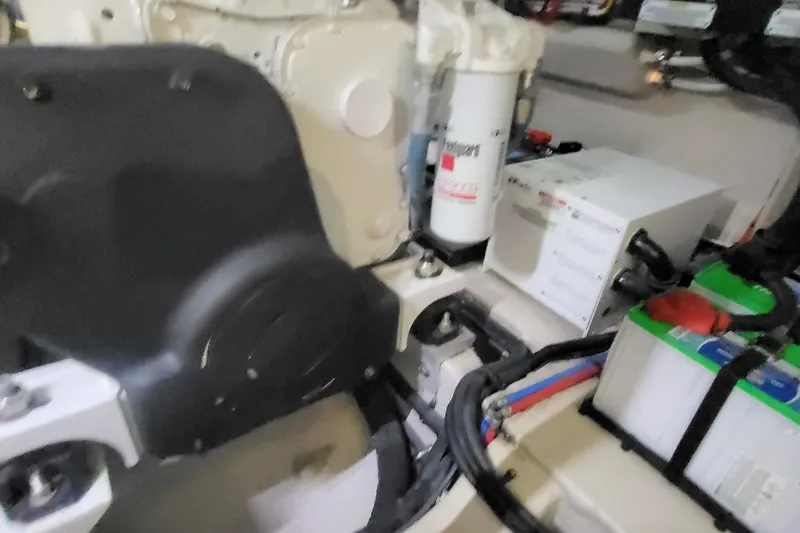 Slide: The Image of Engine room of 2018 Sea Ray L590 Fly yacht, showcasing mechanical components and wiring. - 72