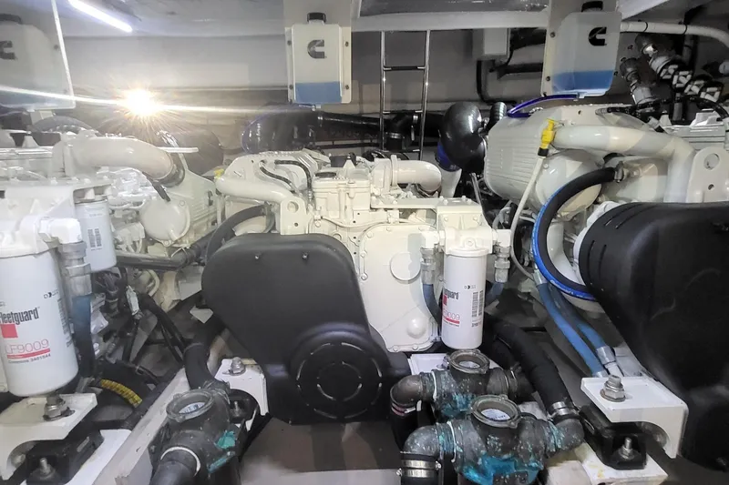 Slide: The Image of Engine room of 2018 Sea Ray L590 Fly yacht, showcasing mechanical components and systems. - 73