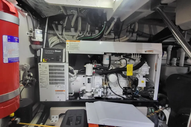 Slide: The Image of Engine room of 2018 Sea Ray L590 Fly with Cummins Onan generator. - 75