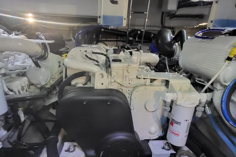 Slide: The Image of Engine room of 2018 Sea Ray L590 Fly yacht, showcasing mechanical components. - 78