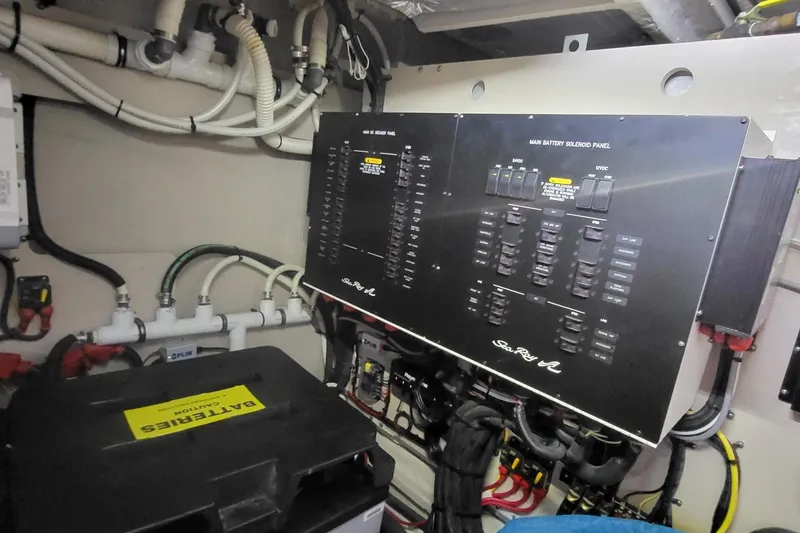 Slide: The Image of Electrical panel and battery compartment in a 2018 Sea Ray L590 Fly yacht. - 79