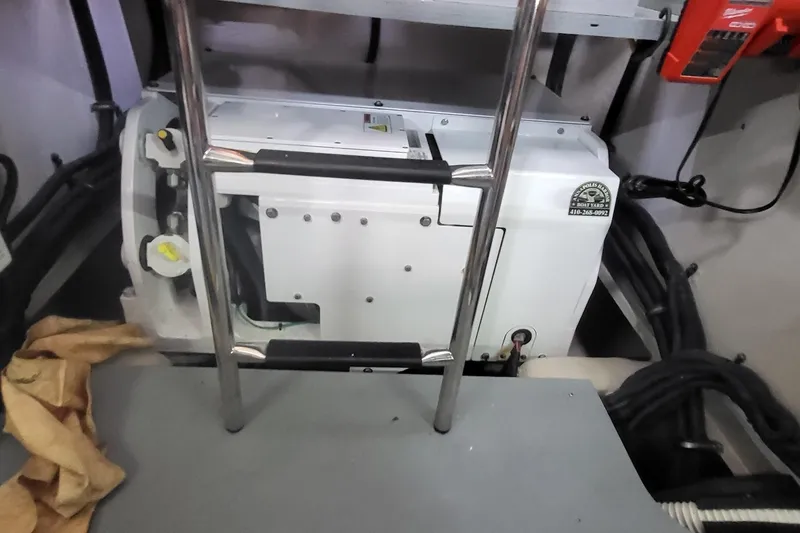 Slide: The Image of Engine room of 2018 Sea Ray L590 Fly yacht with ladder and equipment. - 80