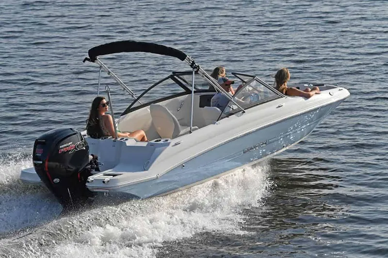 Slide: The Image of Manufacturer Provided Image: 2025 Stingray 191 DC boat cruising on open water with passengers. - 13