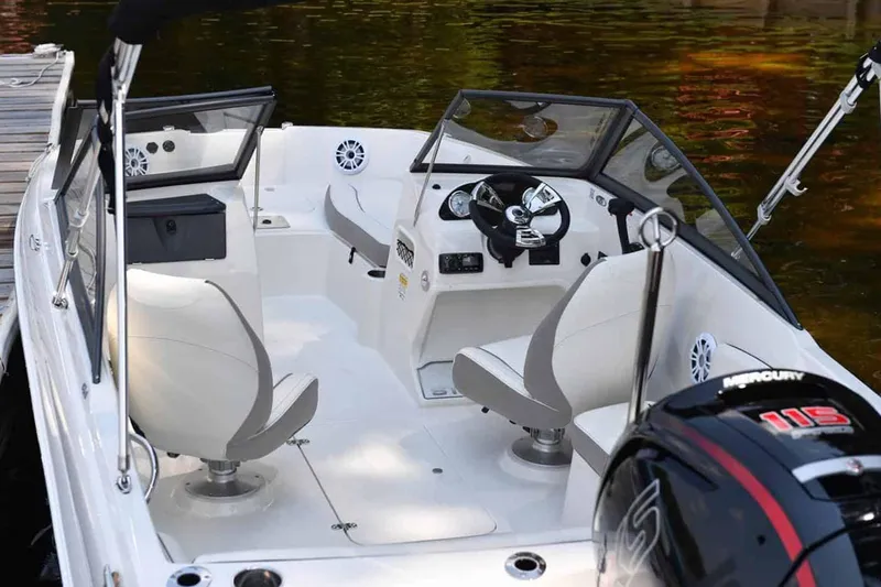 Slide: The Image of Manufacturer Provided Image: 2025 Stingray 191 DC boat interior with modern seating and Mercury engine. - 3