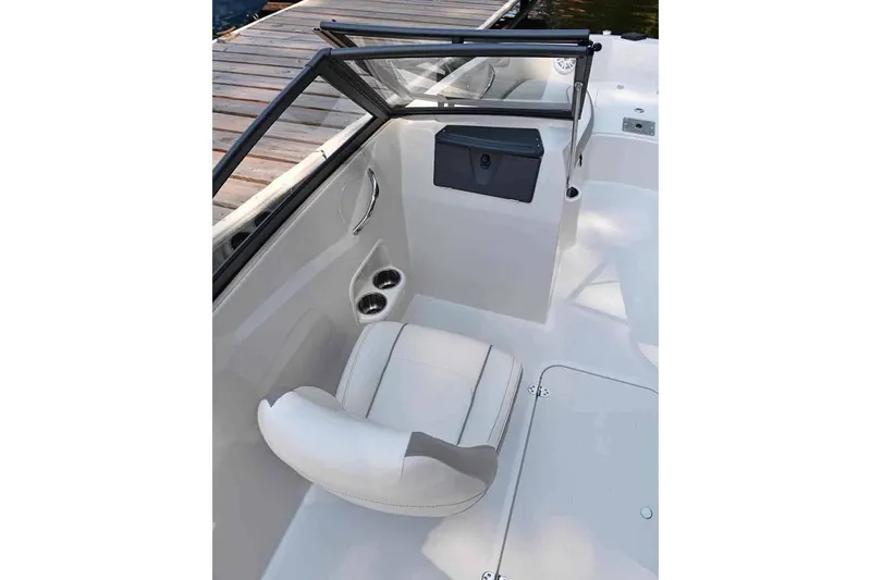 Slide: The Image of Manufacturer Provided Image: 2025 Stingray 191 DC boat interior with white seating and cup holders. - 8