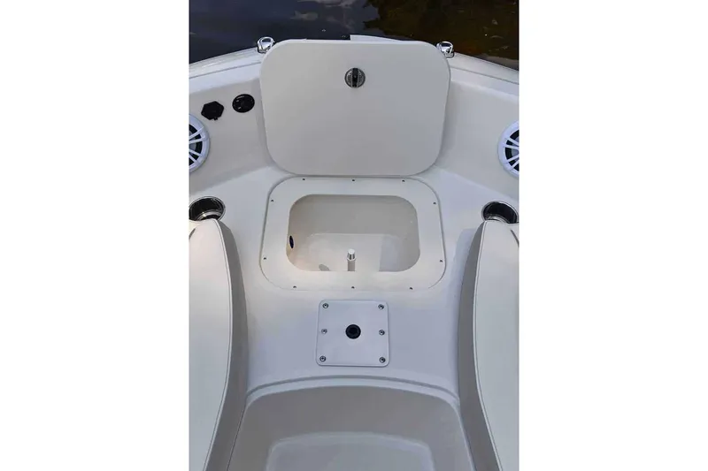 Slide: The Image of Manufacturer Provided Image: 2025 Stingray 191 DC boat interior with storage compartment and speakers. - 9
