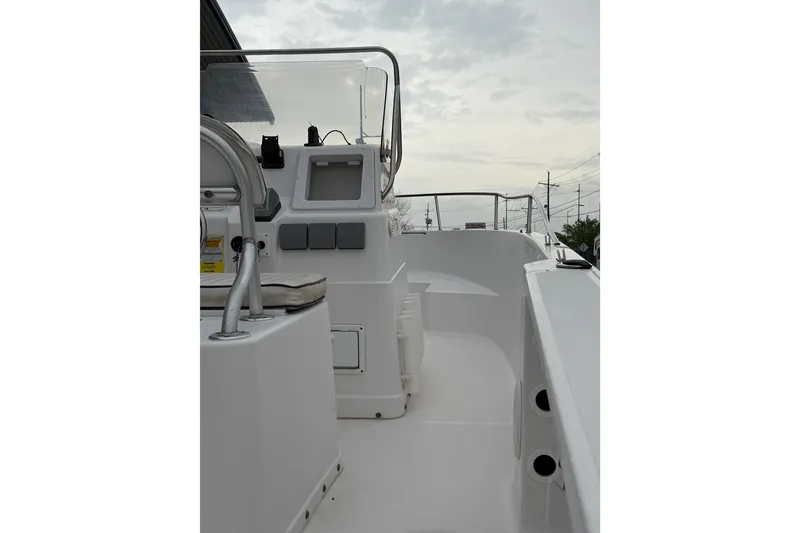 Slide: The Image of 2001 Pro-Line 22 Sport boat interior with steering console and seating. - 11