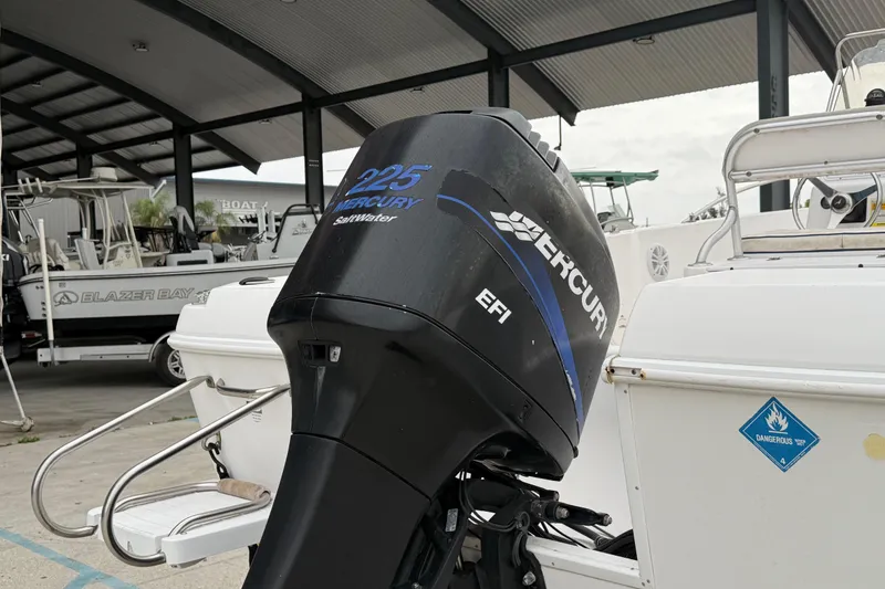 Slide: The Image of 2001 Pro-Line 22 Sport boat with Mercury 225 EFI outboard motor in marina. - 4