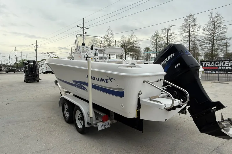 Slide: The Image of 2001 Pro-Line 22 Sport boat on trailer with Mercury EFI outboard motor. - 6