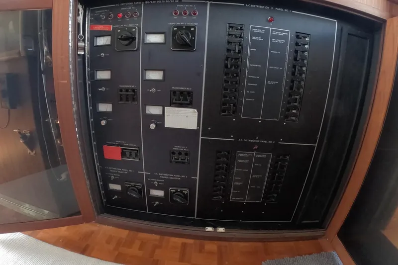 Slide: The Image of Electrical panel on a 1987 Hatteras 54 Motor Yacht, featuring switches and circuit breakers. - 107