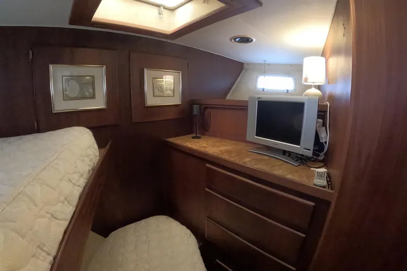Slide: The Image of Interior of 1987 Hatteras 54 Motor Yacht with TV, lamp, and framed art. - 17