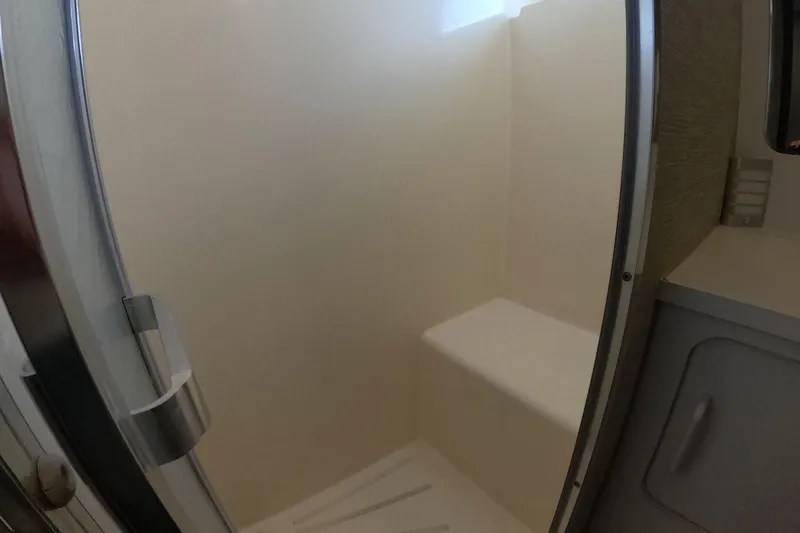 Slide: The Image of Shower area in 1987 Hatteras 54 Motor Yacht, featuring a sleek, modern design. - 24