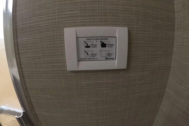 Slide: The Image of Control panel for toilet flush on 1987 Hatteras 54 Motor Yacht. - 31