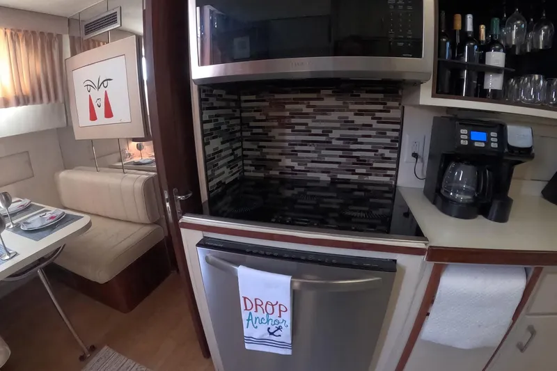 Slide: The Image of 1987 Hatteras 54 Motor Yacht kitchen with modern appliances and stylish decor. - 33