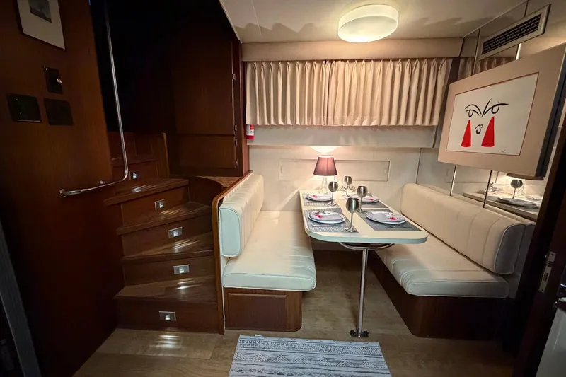 Slide: The Image of Interior of 1987 Hatteras 54 Motor Yacht with elegant dining area and modern decor. - 67