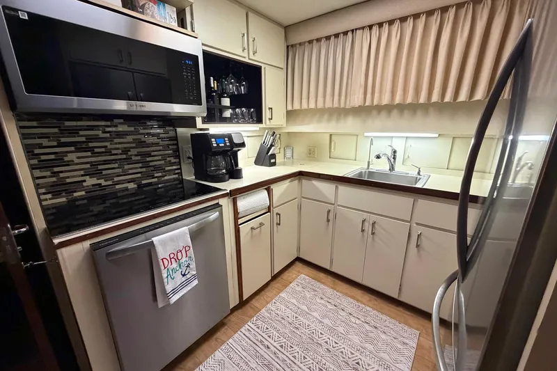 Slide: The Image of Compact kitchen in a 1987 Hatteras 54 Motor Yacht with modern appliances. - 70