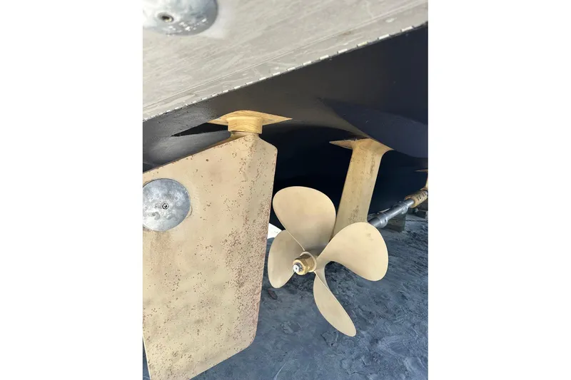 Slide: The Image of Propeller and rudder of 1987 Hatteras 54 Motor Yacht on dry dock. - 84