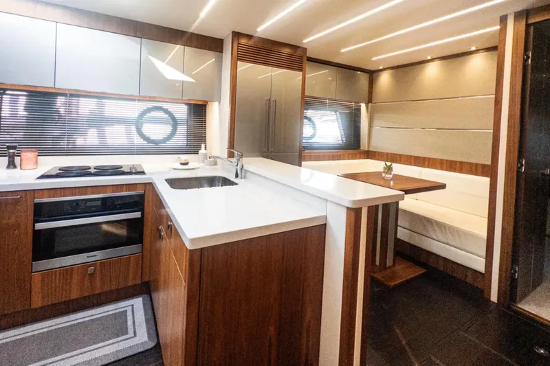 Slide: The Image of Luxurious interior of 2020 Sunseeker Predator 74 yacht with modern kitchen and dining area. - 15