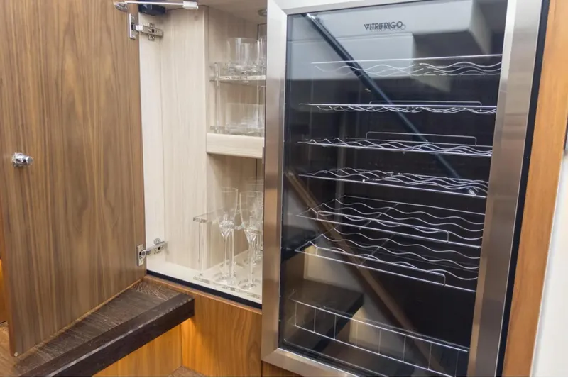 Slide: The Image of Wine cooler and glass cabinet on 2020 Sunseeker Predator 74 yacht interior. - 17