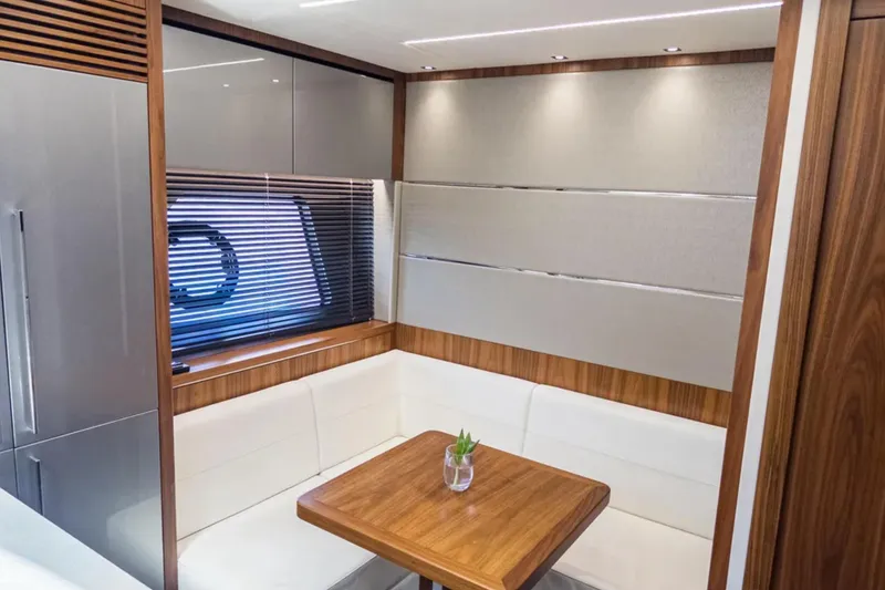 Slide: The Image of Luxurious interior of 2020 Sunseeker Predator 74 yacht with elegant seating and wooden accents. - 18