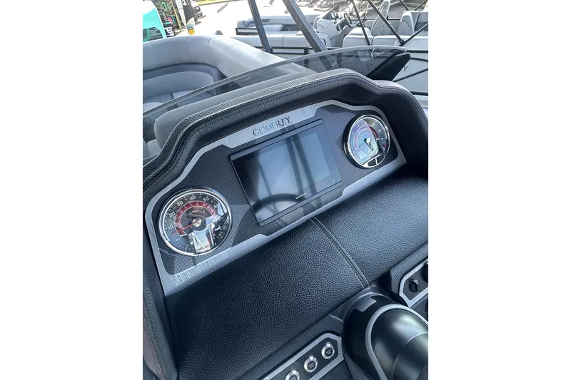 Slide: The Image of Dashboard of 2026 Godfrey Monaco 235 SFL boat with modern gauges and controls. - 12