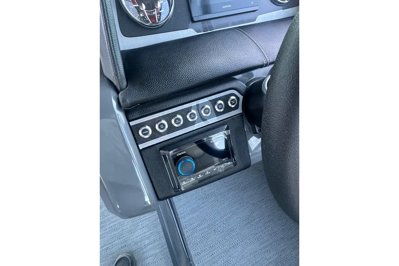 Slide: The Image of Control panel of 2026 Godfrey Monaco 235 SFL boat with switches and display. - 13