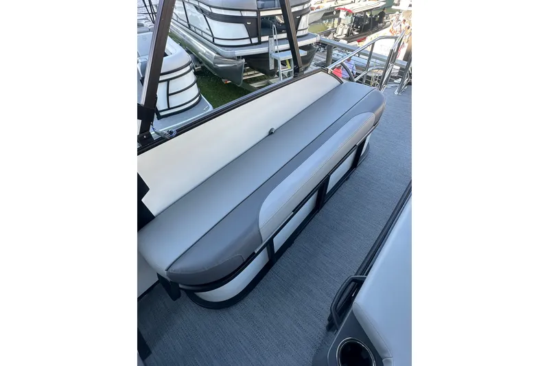 Slide: The Image of 2026 Godfrey Monaco 235 SFL boat interior with sleek gray seating and modern design. - 15