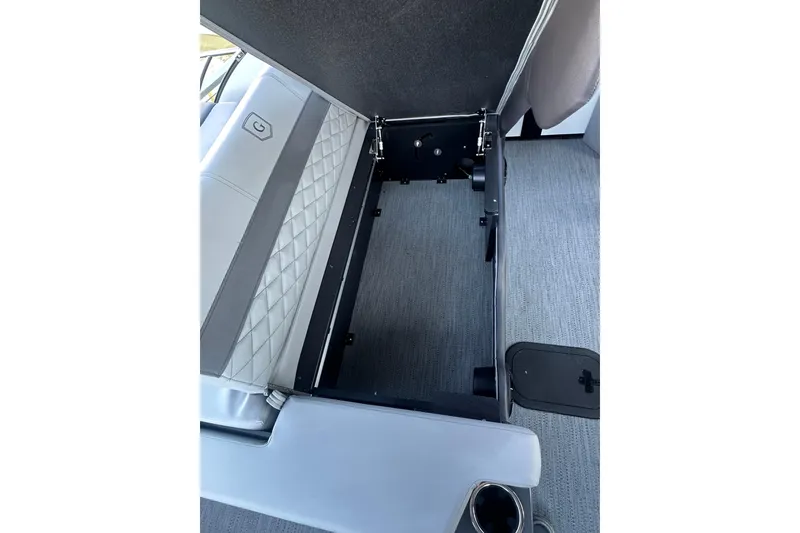 Slide: The Image of Open storage compartment in 2026 Godfrey Monaco 235 SFL boat with quilted seat design. - 21