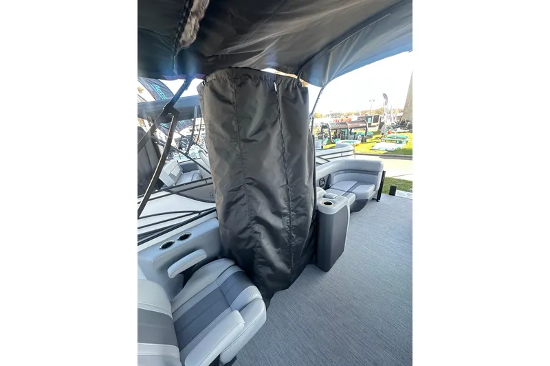 Slide: The Image of 2026 Godfrey Monaco 235 SFL boat interior with seating and privacy curtain. - 24