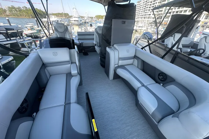 Slide: The Image of Luxurious interior of 2026 Godfrey Monaco 235 SFL pontoon boat at marina. - 27