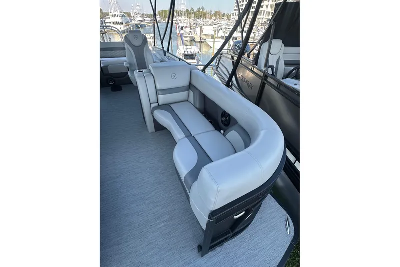 Slide: The Image of Luxurious seating on 2026 Godfrey Monaco 235 SFL boat at marina. - 7
