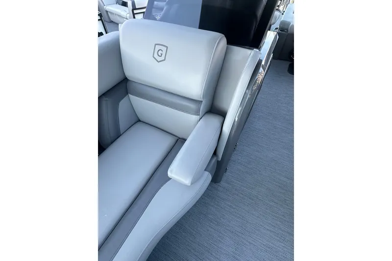 Slide: The Image of Luxurious seating on 2026 Godfrey Monaco 235 SFL pontoon boat, featuring elegant gray upholstery. - 8
