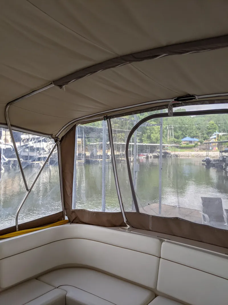 Slide: The Image of Interior view of 2004 Rinker Fiesta Vee 410 boat with marina backdrop. - 14