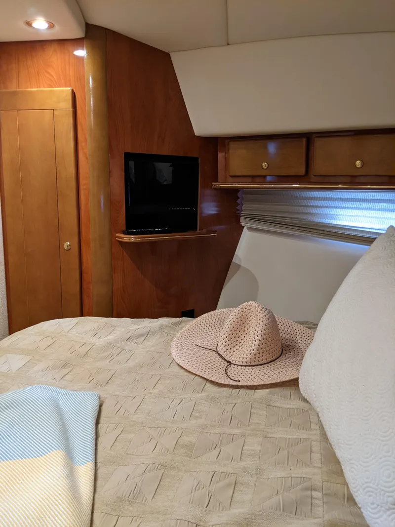 Slide: The Image of Interior of 2004 Rinker Fiesta Vee 410 yacht with cozy bedroom and TV. - 17