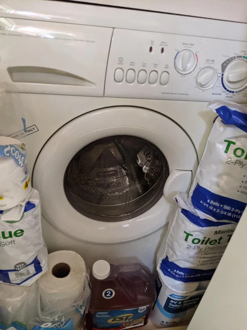 Slide: The Image of Washing machine surrounded by toilet paper and detergent, Rinker Fiesta Vee 410, 2004. - 25