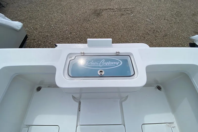 Slide: The Image of 2026 Pair Customs 24 Center Console DV Offshore boat, featuring a sleek white deck design. - 10
