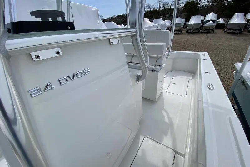 Slide: The Image of 2026 Pair Customs 24 Center Console DV Offshore boat interior with sleek white design. - 14