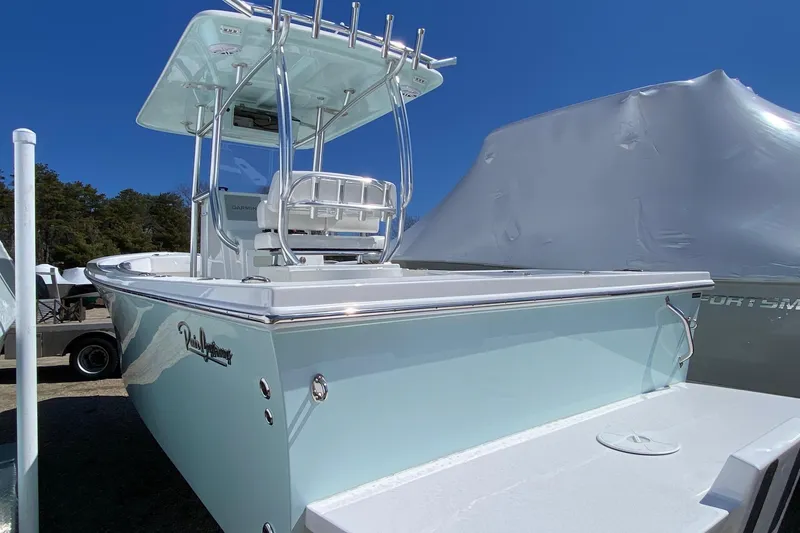 Slide: The Image of 2026 Pair Customs 24 Center Console DV Offshore boat with sleek design and modern features. - 2